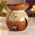 Light brown ceramic moon and star wax warmer